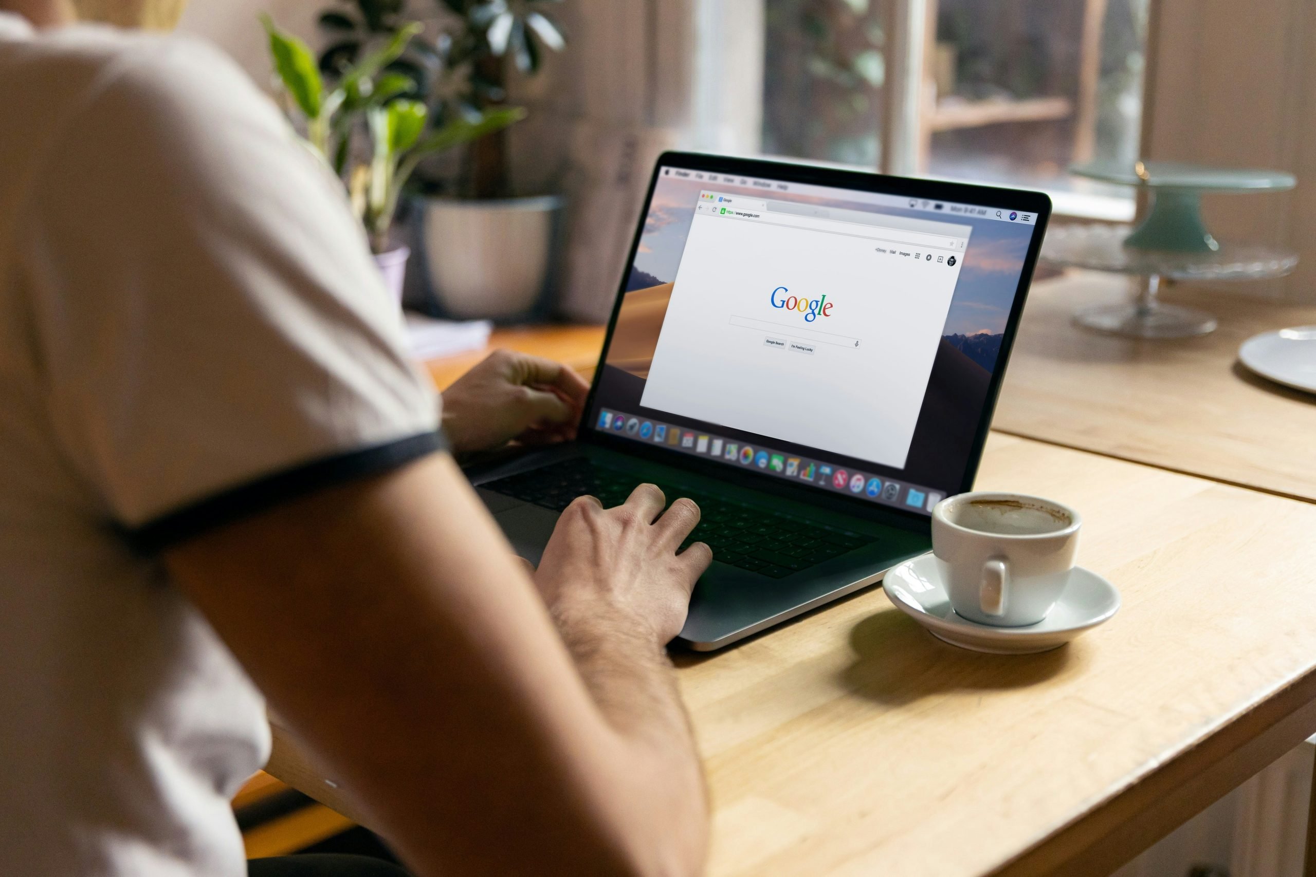 Laptop with Google search on it laying on a table