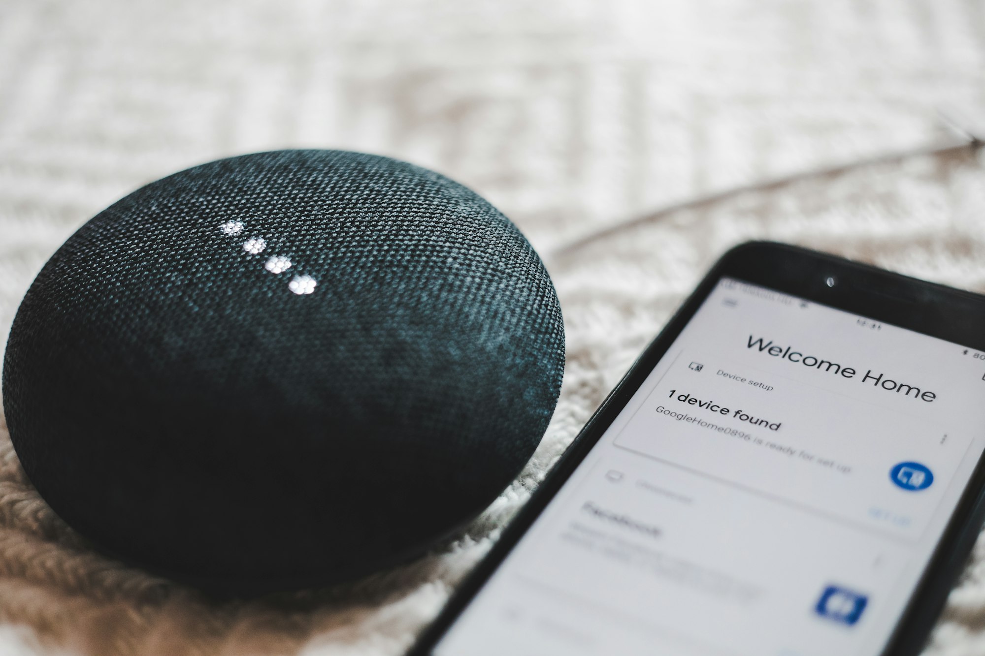 Smart speaker next to a smartphone for voice search