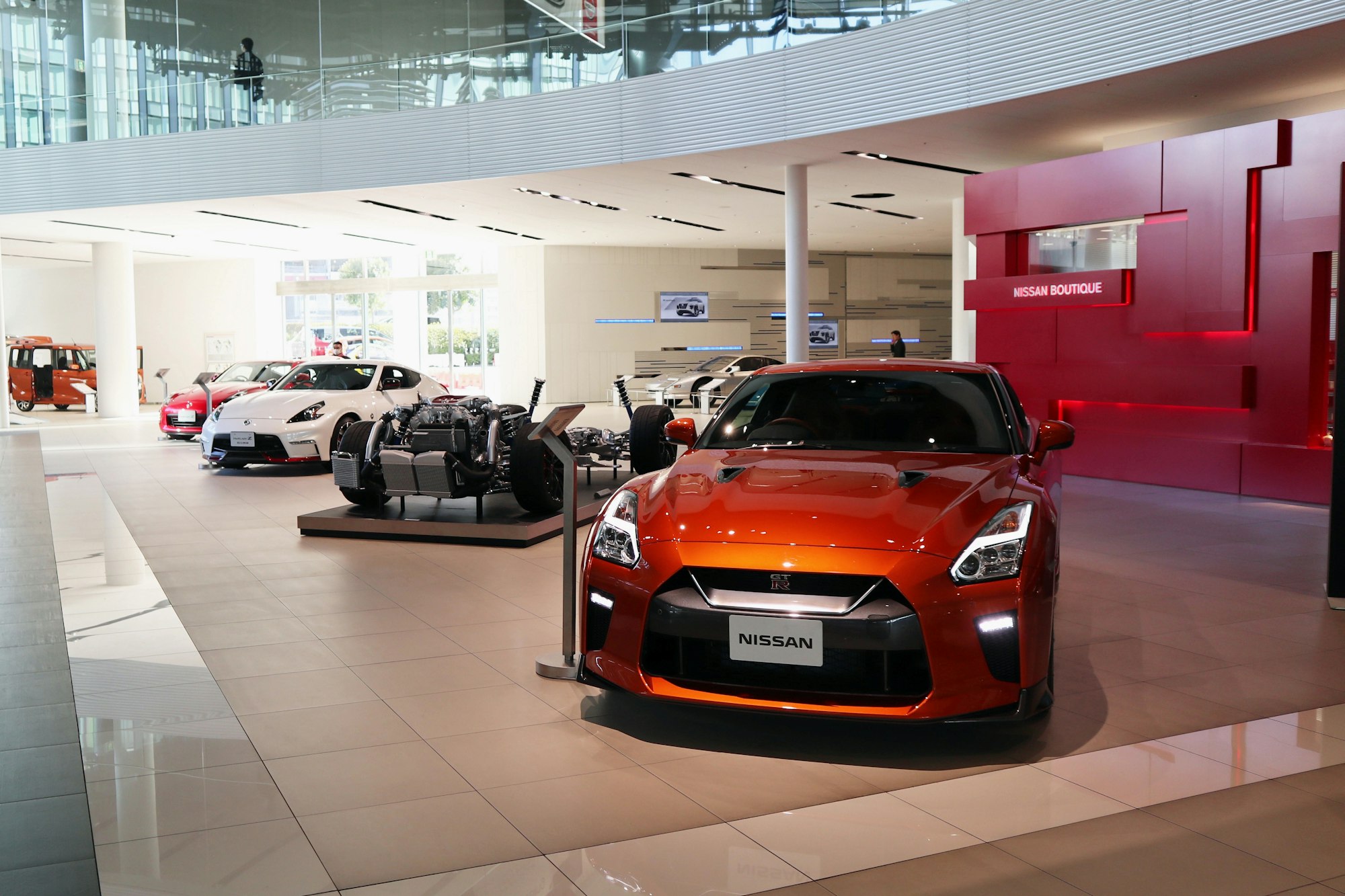 Car dealership showroom with sports cars on display